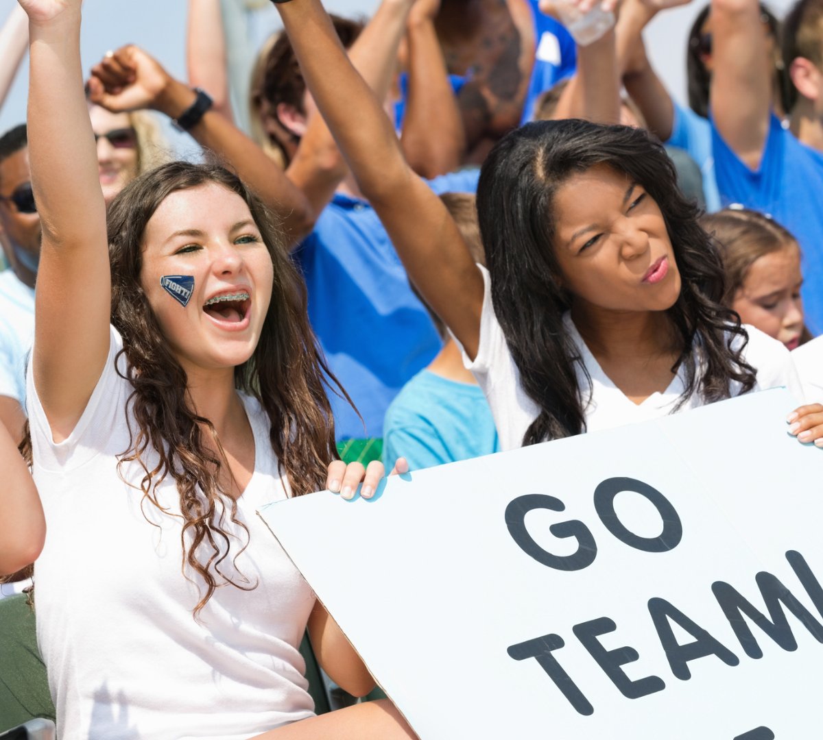 teenagers showing school spirit while wearing bulk white tshirts